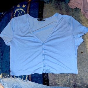 blue top with buttons on front